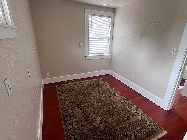 Bedroom 3 with small staircase to attic