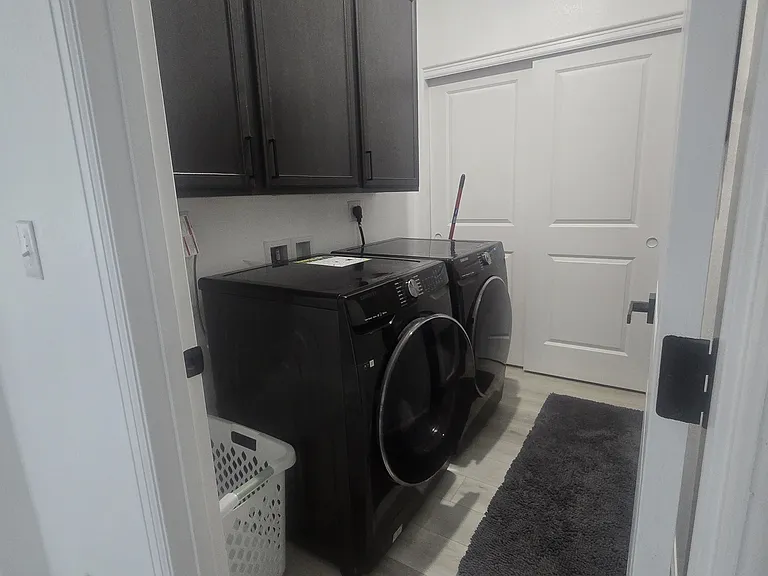 Laundry Room& Furnace Room. Man Door and dog door leading into the 2 Car Garage (Washer and Dryer not Included)