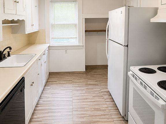 Kitchen, brand new flooring added in July 2026. Natural lighting, plenty of cabinet space, all appliances pictured are included in lease.