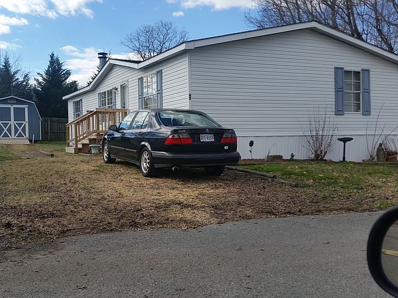 Wood storage shed in back