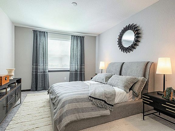 Experience tranquility in this beautifully designed modern bedroom.