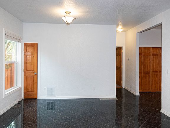 Beautiful black granite flooring in dining area has silver specks