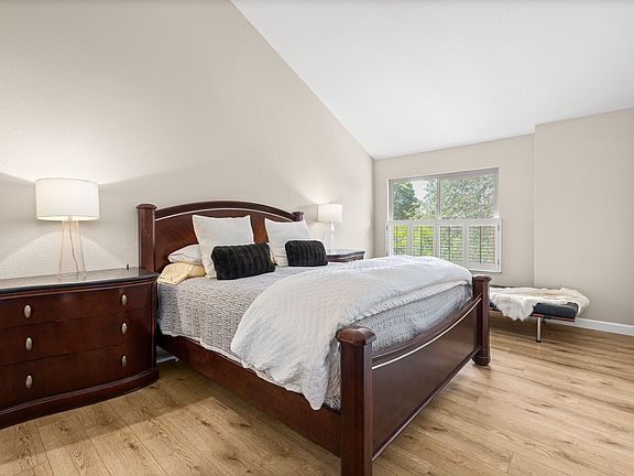 Primary bedroom with view of hills and open space
