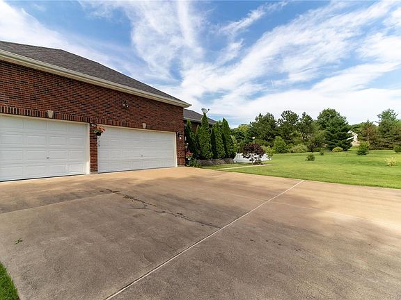 3 car oversized garage with a HUGE driveway