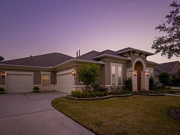 Gorgeous Taylor Morrison Home with lots of upgrades.  Stone/Stucco elevation gives warmth and richness to this spacious floor plan.  Green belt to the left of the home and behind add to the spaciousness of the lot! 3 car split load garage.