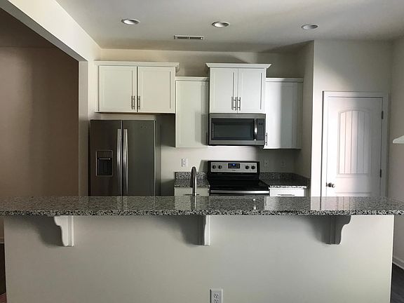Kitchen with Granite and Stainless Appliances and Upgraded C