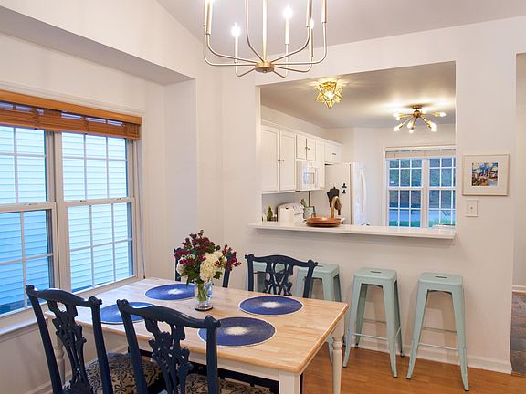 kitchen opens to the dining area and living room