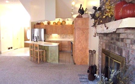 View of fireplace & kitchen!