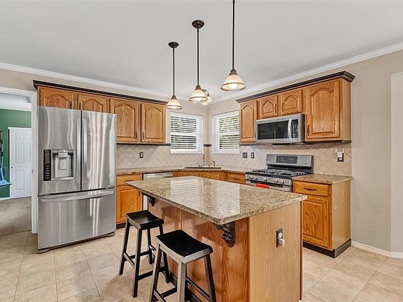 Granite counters and tile backsplash