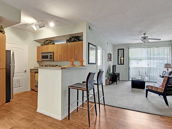 Acclaim Apartments- furnished kitchen with wooden floors