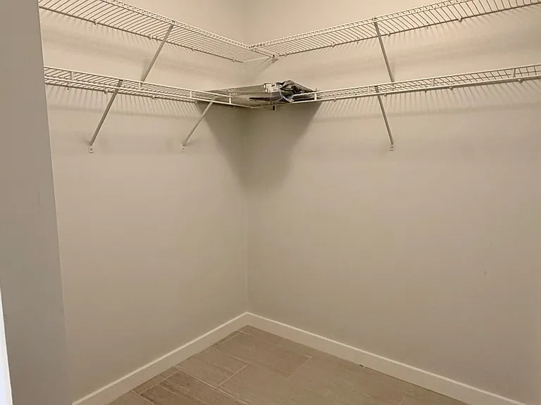 Entering the HUGE bedroom walk-in closet!
