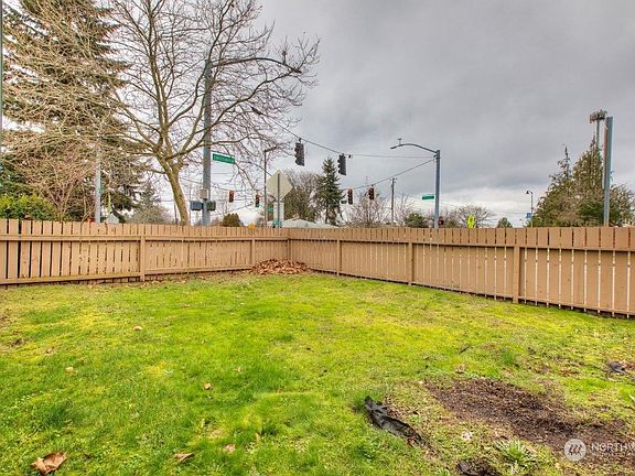 Expansive yard is fully fenced for privacy.>