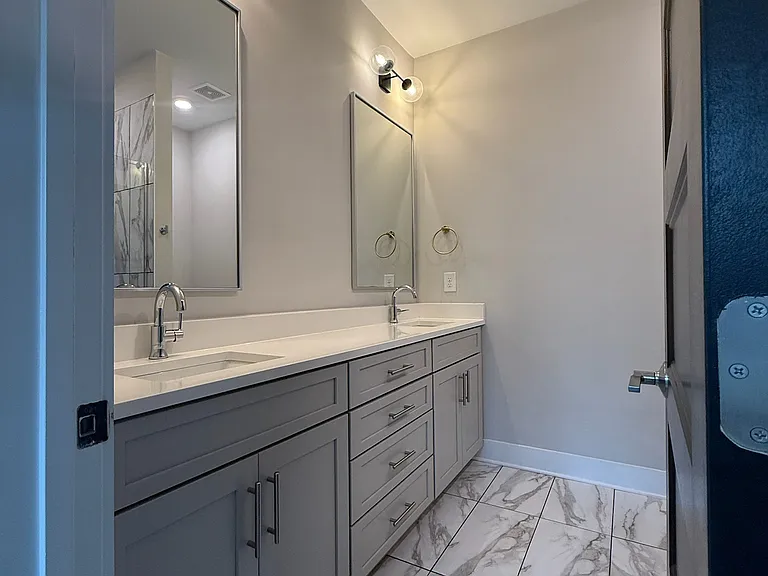 Primary attached bathroom dual vanities