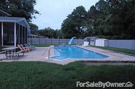 Back yard / Pool
						:
						Totally fenced in back yard with 60 ft long pool, screened in porch and sheds