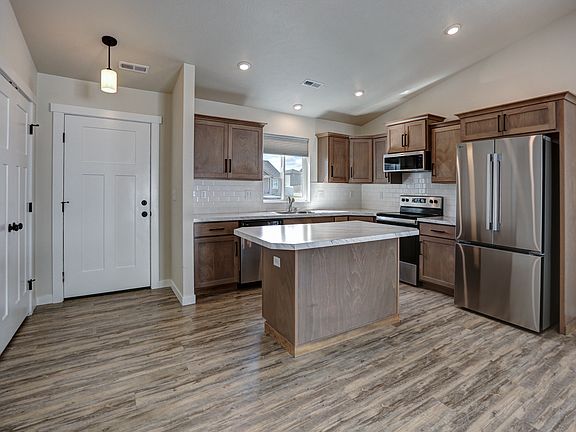 Kitchen - Stainless Whirlpool Appliances. Electric Glass Top Range, Slim Microhood, Dishwasher & Side X Side Fridge, Double Door Closet Can Be Used As Closet Or Pantry, Front Door