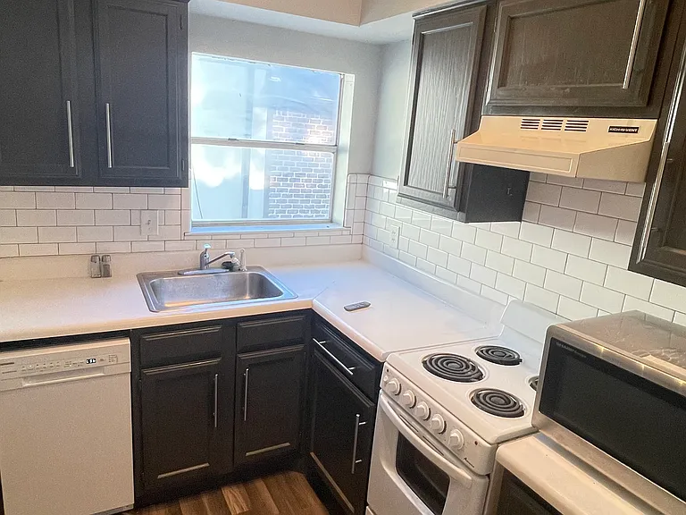 Updated kitchen featuring decorative lighting.
