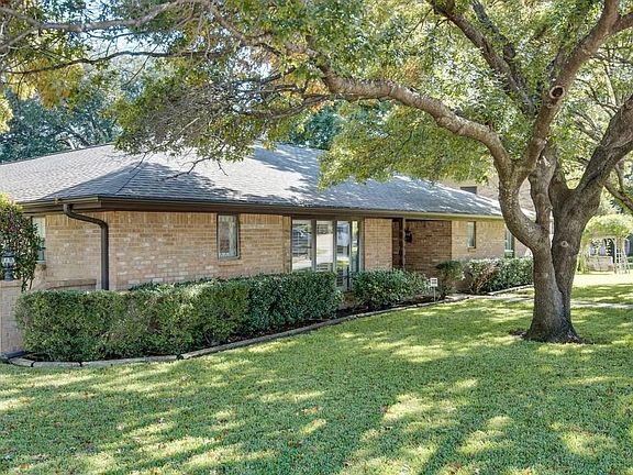 Beautiful Home nestled on this lush corner lot