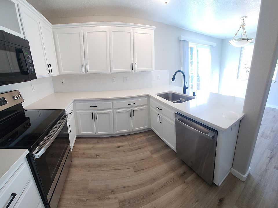 Kitchen with quartz counters and all new appliances.