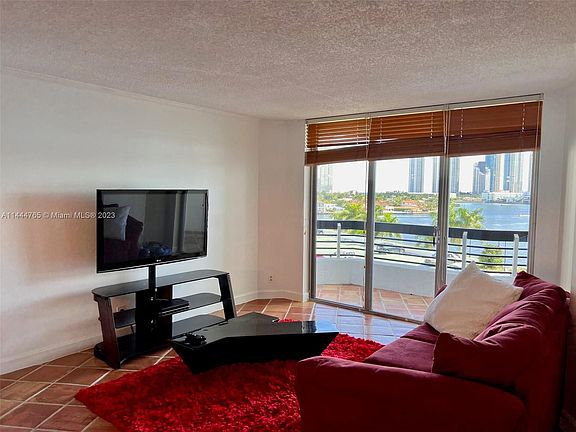 3rd image of 3600 Mystic Pointe Dr APT 715