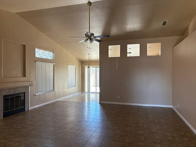 Family room view to kitchen and backyard slider