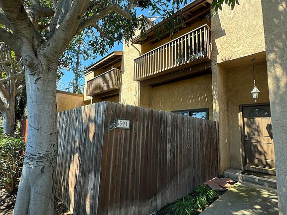 Front Entry- View of Private Patio and Balcony.