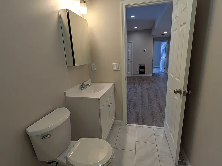 Bathroom is right off of the kitchen and features a shower/tub