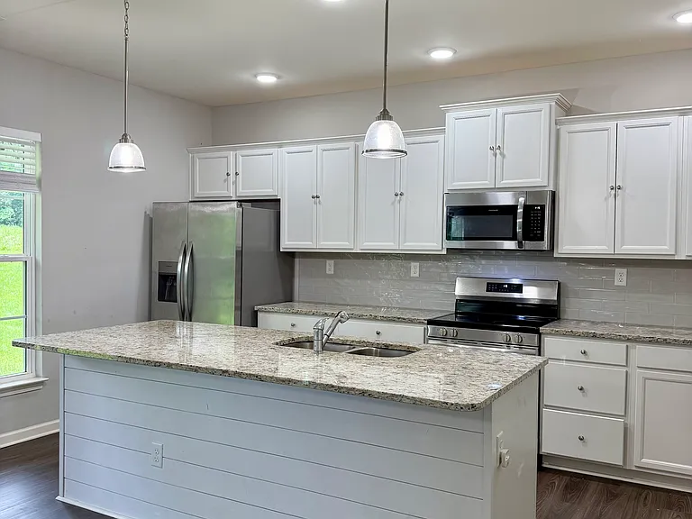 kitchen with large island and walkin pantry
