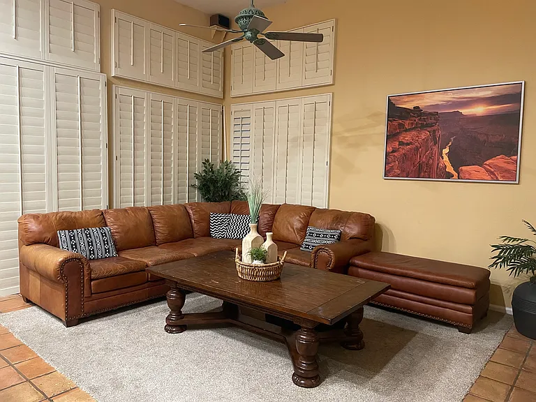 Family Room with Shutters and tall ceilings. There is another formal living and dining room
