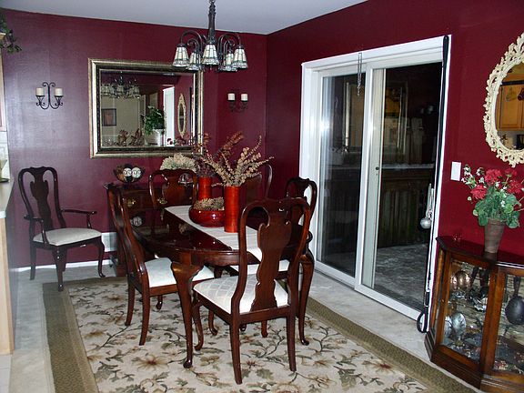 formal dining room with sliders to private deck with wooded views