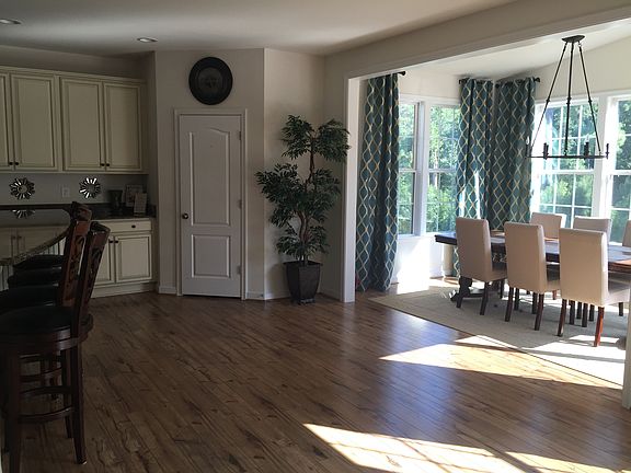 Open concept space between dining and island looking at larg