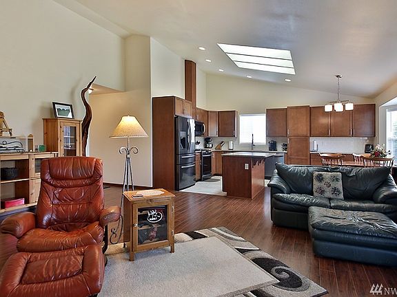 As you come inside, there is an office space with french door to the left and a spacious coat closet straight ahead.  The archway on your left leads to the master suite, laundry room and garage.