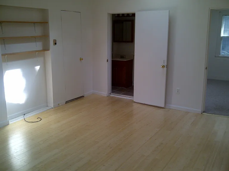living room facing bath and bedroom