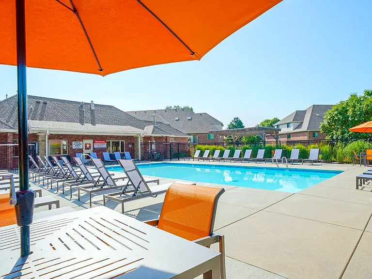 Poolside perfectionstretch out on a lounge chair, catch up with friends at the tables, or challenge them to a game of cornhole!