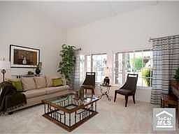 FORMAL LIVING ROOM WITH SOARING CEILINGS AND DESIGNER DECOR