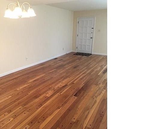 Handsome refinished hardwood floors. Notice the fresh paint, replaced baseboards throughout.