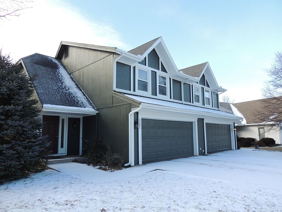 Exterior Front with motorized garage door and entry into kitchen