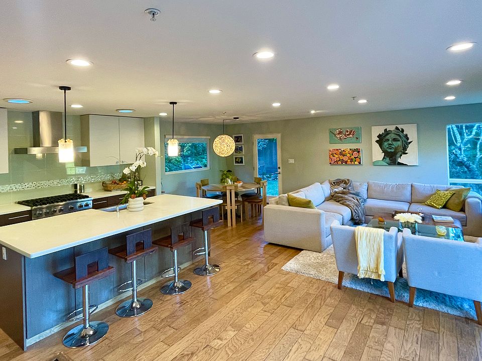 The living space with a French door opening to the deck
