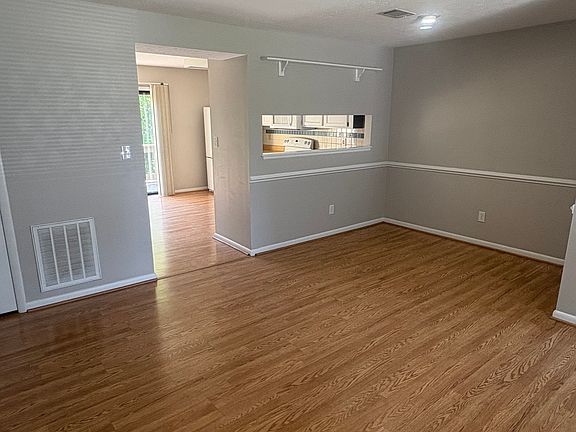 Living and dining areas leading into the kitchen