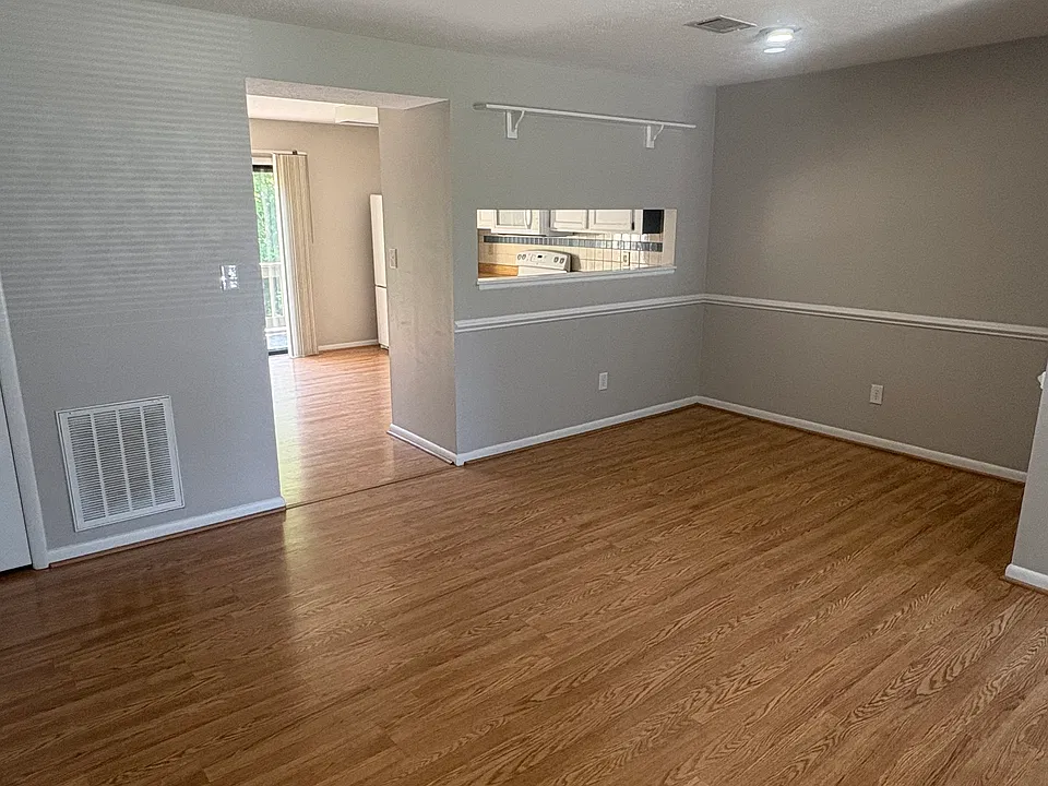 Living and dining areas leading into the kitchen