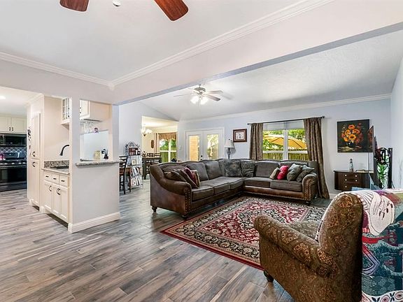 view of the family room into the kitchen and wet bar area
