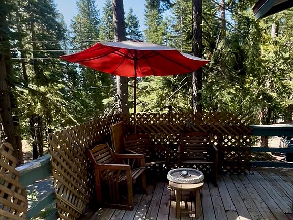 Corner of deck with seating, deck furniture included with rental