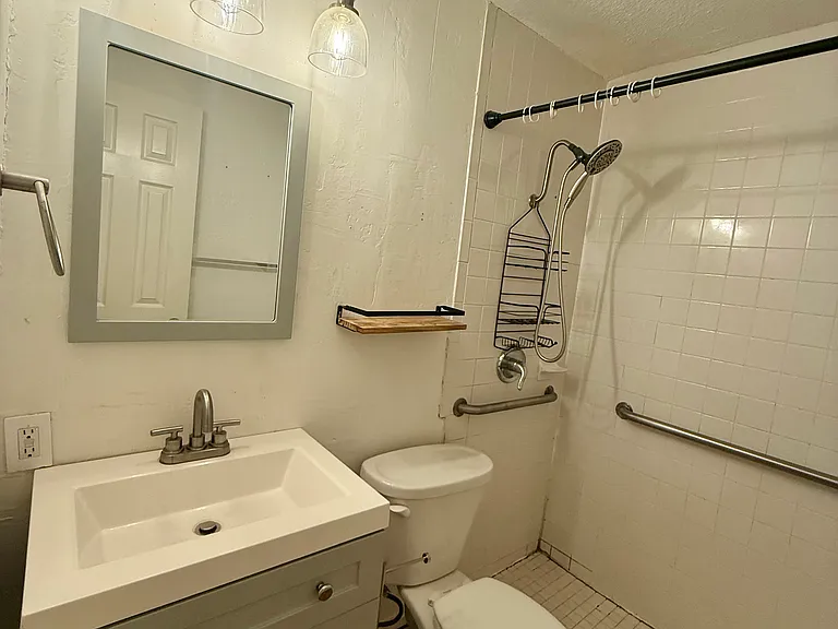 Bathroom in 3rd bedroom.
Note: this shower is being re-grouted and deep cleaned before new tenants move in.