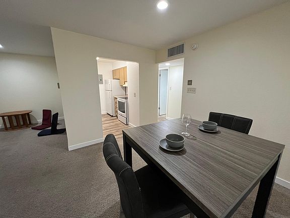 Dining area looking into kitchen and dining
