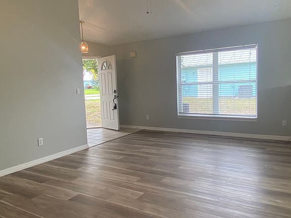 living room looking from hallway to bedrooms