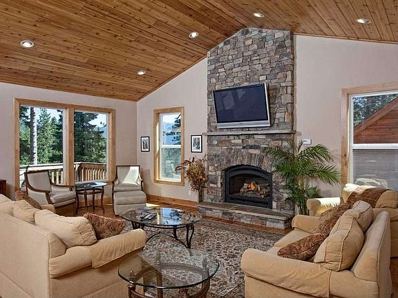 "Enjoy fun gatherings around cozy stone to ceiling fireplace"