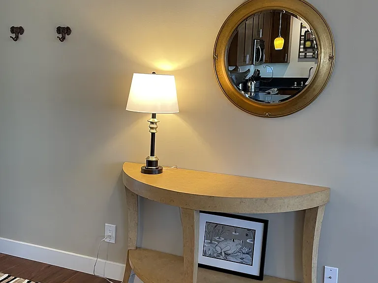 Demi-lune table near the door