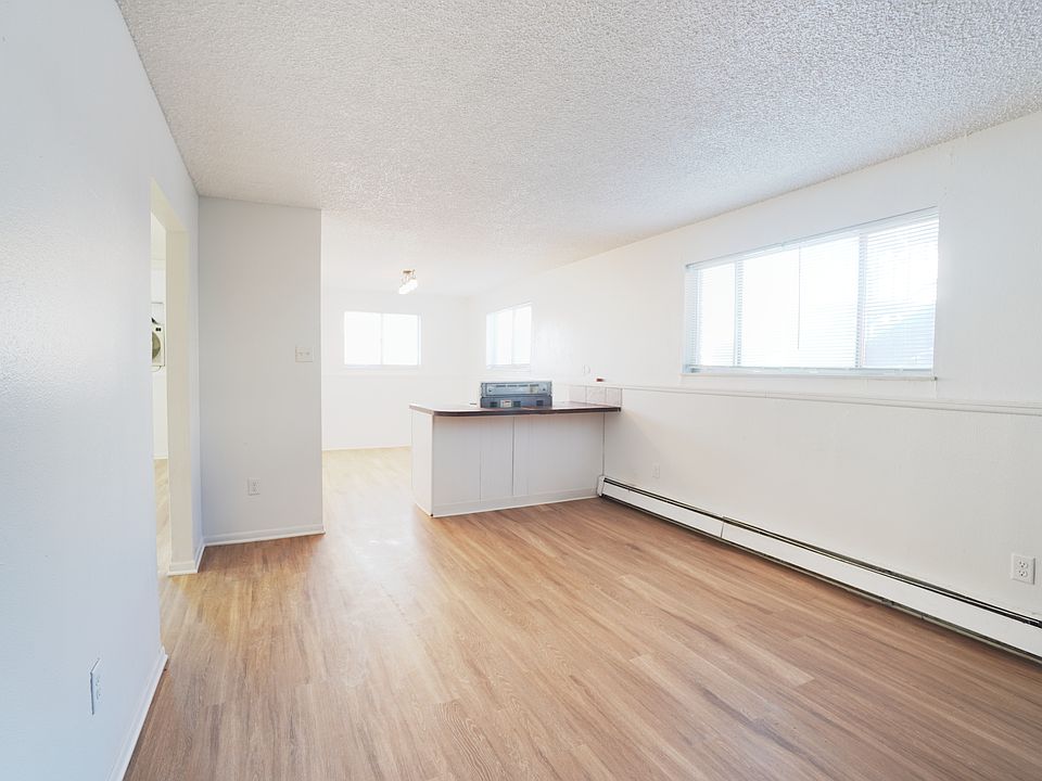 Living room view to open concept kitchen.