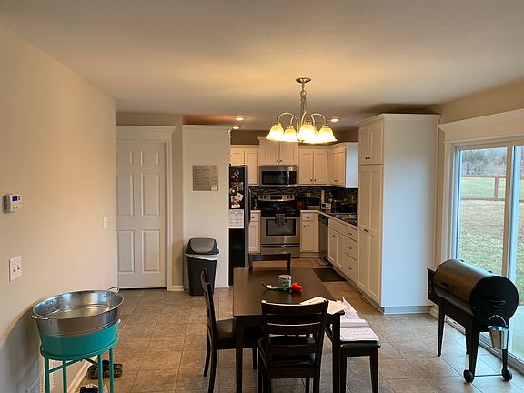 open floor plan to kitchen, dining and living areas.