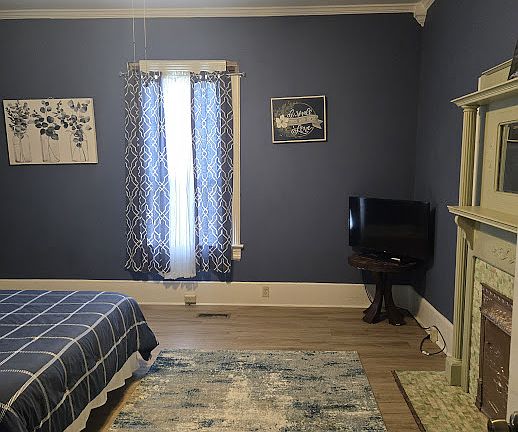 1st bedroom with fireplace