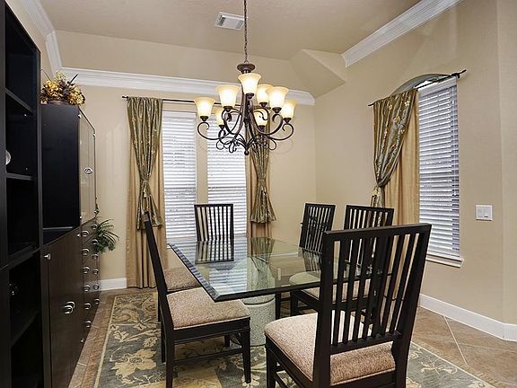 The dining room also features two windows which provide ample natural light.